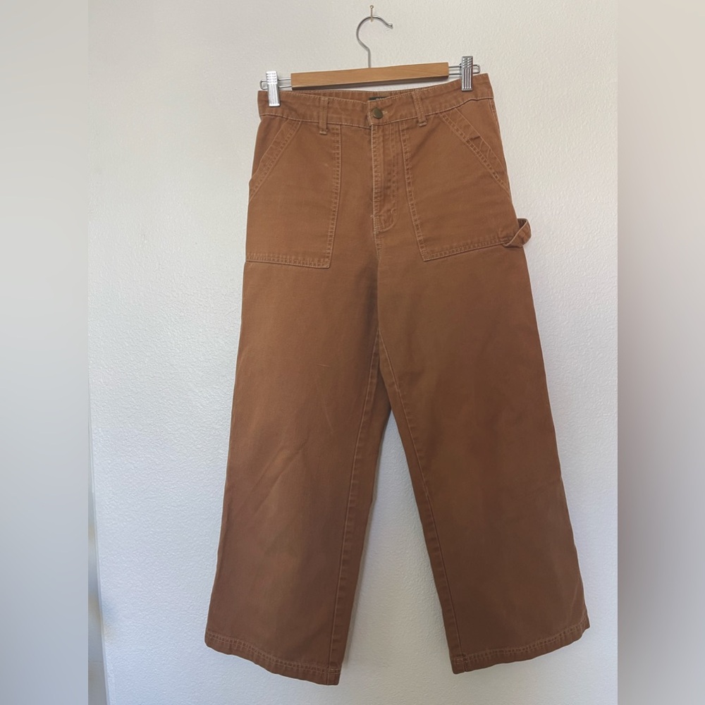 Rust colored painters pants in denim.